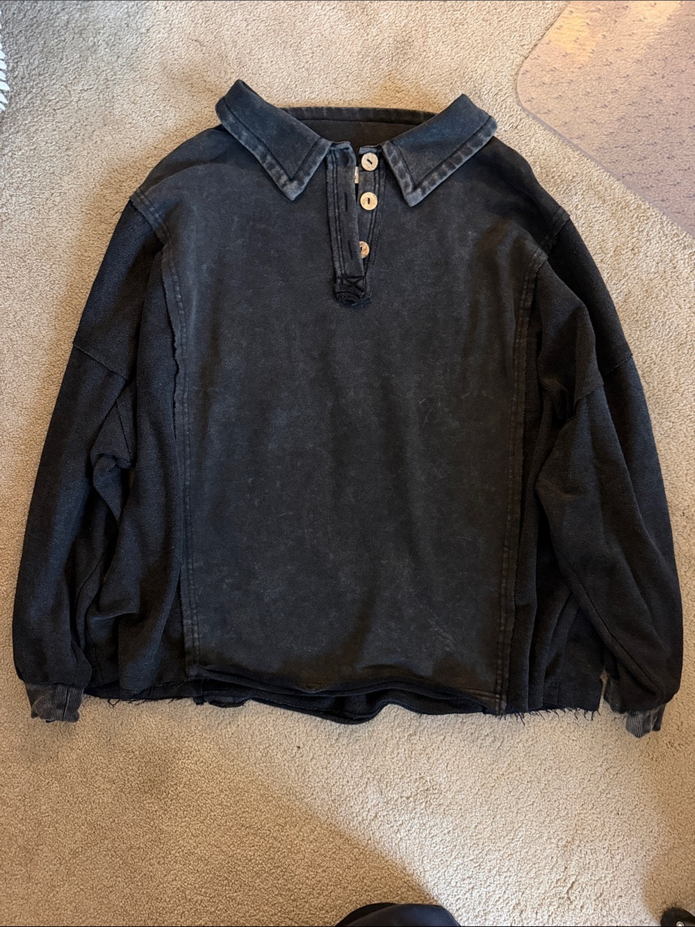 Black crewneck sweatshirt with buttons